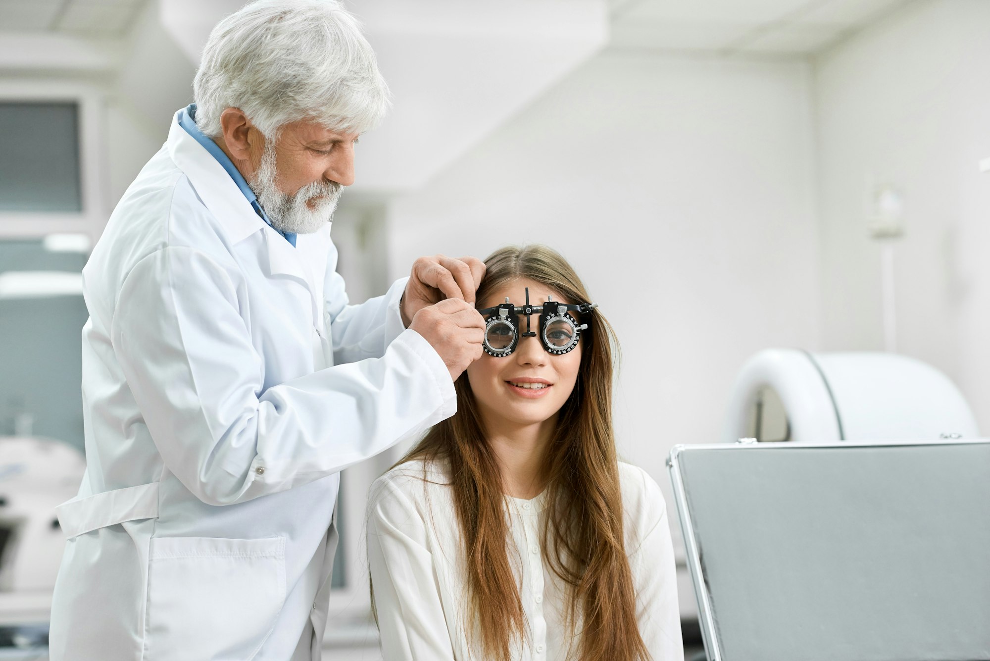Skilled oculist trying visual inspection device